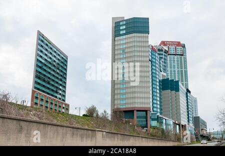 Niagara Falls, Canada - APRIL 25, 2012: View from below of the hotels in Niagara Falls during the day. Embassy Suites and Radisson Hotel can be seen. Stock Photo