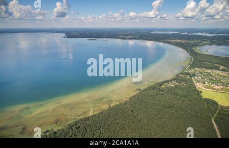 Big lake in forest background aerial drone top view Stock Photo
