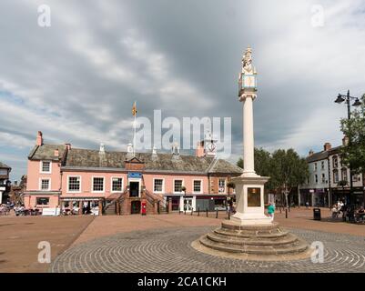 The market cross in Carlisle market place with the old town hall behind, Cumbria, England, UK Stock Photo