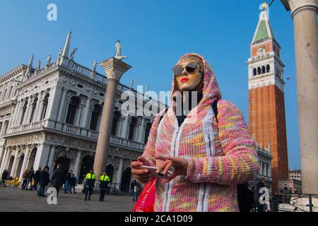 VENICE, ITALY - 28 JANUARY 2018: A person with a hood and a face mask during Venice Carnival Stock Photo