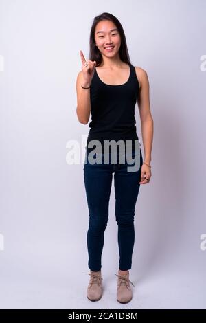 Portrait of happy young beautiful Asian woman Stock Photo