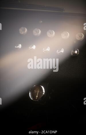 Close up shot of an ampere meter on a vintage car dashboard. Stock Photo
