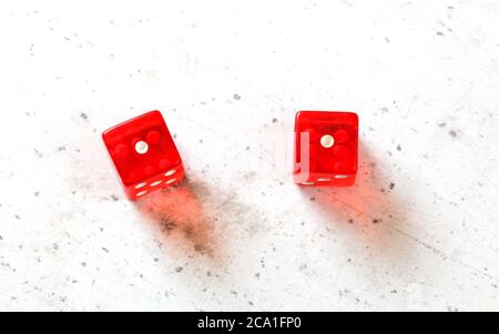 Two red craps dices showing Snake Eyes (double number one) overhead shot on white board Stock Photo