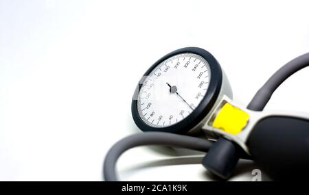 a portable sphygmomanometer isolated on a white background. Instrument for measuring blood pressure. Graduated scale with pressure indicator. Medical Stock Photo