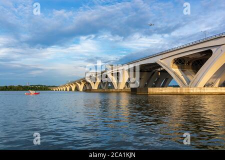 The Woodrow Wilson Memorial Bridge spans the Potomac River between Alexandria, Virginia, and the state of Maryland as seen from Jones Point Park. Stock Photo