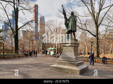 Christopher Columbus Statue (by  Jeronimo Suol)  in Central park New York city daylight view with trees and clouds in sky Stock Photo