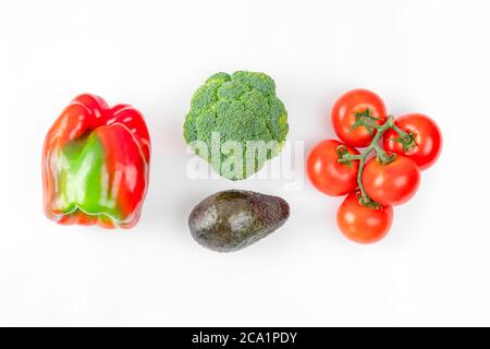 Flat lay composition with fresh fruits and vegetables on white background. Broccoli, tomato, pepper, avocado. Creative layout. Food art concept Stock Photo