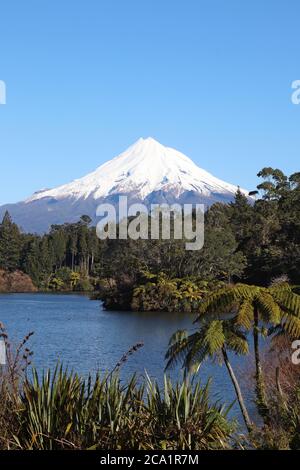 Mount Taranaki New Zealand view from lake Mangamahoe with native trees Stock Photo