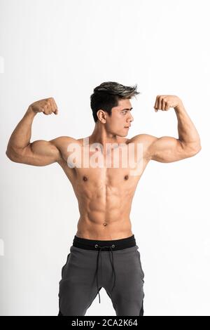 Young bodybuilder showing chest muscles in front pose Indian Body ...