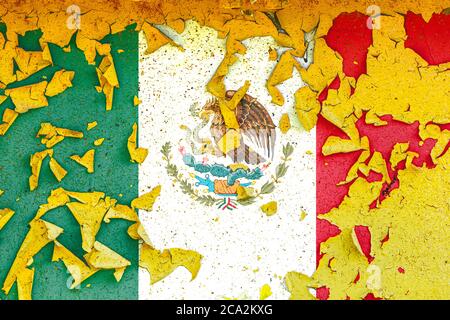 The national flag of Mexico  is painted on an old metal wall with ragged paint. Country symbol. Stock Photo