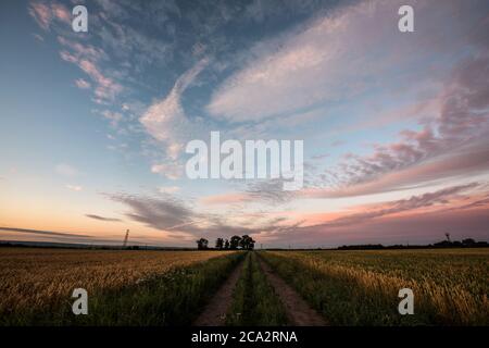 Dawn colours over Bingham, Nottinghamshire, with parts of the UK looking set for a scorching weekend and temperatures that could reach 36C. Stock Photo