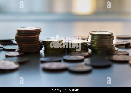 Euro and Europe Coins stacks,diferent sizes and colors.Saving money concept,business and banking..Blurred background Stock Photo