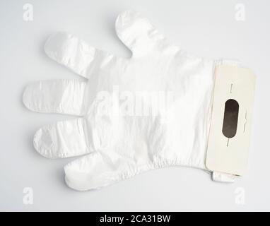 disposable polyethylene gloves on a white background, top view, flat lay.