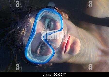Portrait of Woman Snorkeling View from Above.
