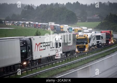 Frasdorf, Germany. 04th Aug, 2020. Trucks are stuck in traffic jams on the Autobahn 8 in the direction of Munich. Due to heavy, continuous rainfall, the A8 has been closed in parts due to flooding. Credit: Matthias Balk/dpa/Alamy Live News Stock Photo