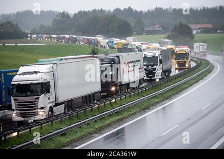 Frasdorf, Germany. 04th Aug, 2020. Several trucks are stuck in traffic jams on the Autobahn 8 in the direction of Munich. Due to heavy, continuous rainfall, the A8 has been closed in parts due to flooding. Credit: Matthias Balk/dpa/Alamy Live News Stock Photo