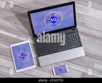 5g concept shown on different information technology devices Stock Photo