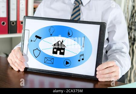 Smart home automation concept shown by a businessman Stock Photo