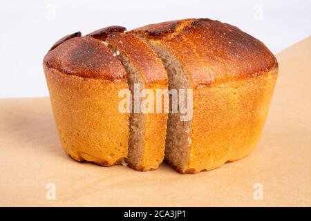 bakery products, freshly baked wheat bread, slices of bread, loaf isolated on white background, bakery. Stock Photo