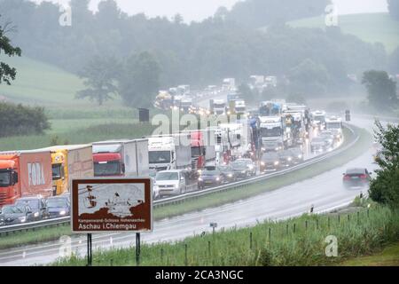 Frasdorf, Germany. 04th Aug, 2020. Trucks are stuck in traffic jams on the Autobahn 8 in the direction of Munich. Due to heavy, continuous rainfall, the A8 has been closed in parts due to flooding. Credit: Matthias Balk/dpa/Alamy Live News Stock Photo
