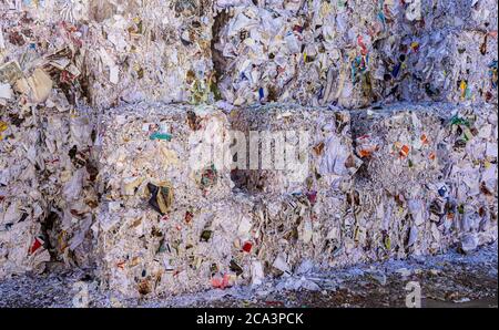 Sweden, Orebro, 24.02.2020: Bales of cardboard and box board. Waste paper for Recycling. Background of paper textures, Paper garbage at the recycling Stock Photo