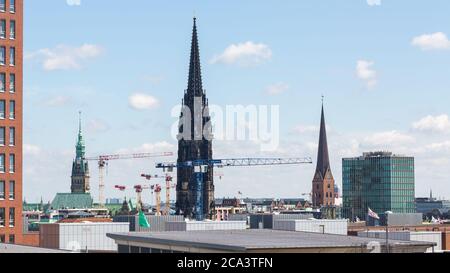 Cityscape of Hamburg with the steeple of church St. Nikolai. The ruins of the church are today a WWII memorial. Stock Photo