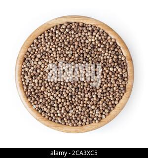 Dried coriander seeds in wooden bowl isolated on white background with clipping path Stock Photo