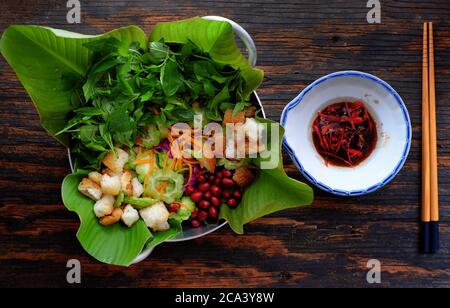 bitter melon salad with violet cabbage, carrot, fried bread, peanut with basil, sour mixed vegetable for vegan cuisine, diet dish for healthy eating Stock Photo