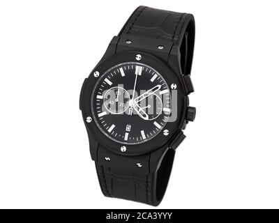 stylish men's wristwatch of black color with white arrows and a rubber strap with leather stamping isolated on a white background. Stock Photo