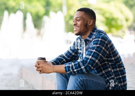 Portrait of african american guy sitting with coffee Stock Photo