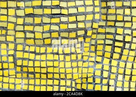 Background from Mosaic of yellow color from square tiles. Stock Photo