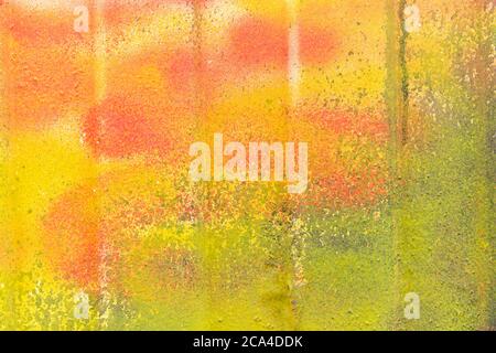 Metal siding different gradients of shades of yellow, red and green. Stock Photo