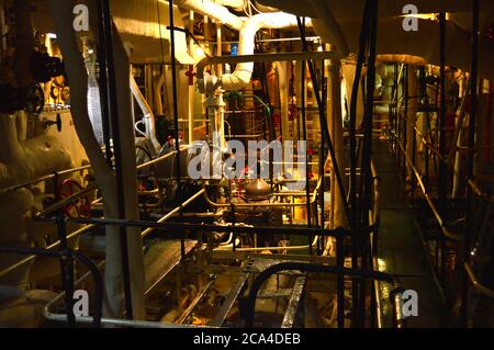 Dark engine room in a ship Stock Photo