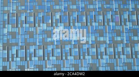 pattern on a building's glass panes with different shades of blue and grey Stock Photo