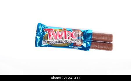 Twix Cookies & Creme Cookie Candy Bar with wrapper opened showing milk chocolate covered bars Stock Photo