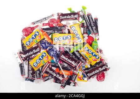 Pile of assorted candies including Tootsie Rolls, Dots, Tootsie Pops Stock Photo