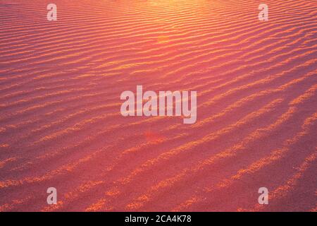 Sand pattern in the warm evening sunlight Stock Photo