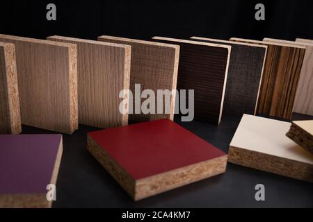 chipboard laminate furniture material samples on black background. banner Stock Photo