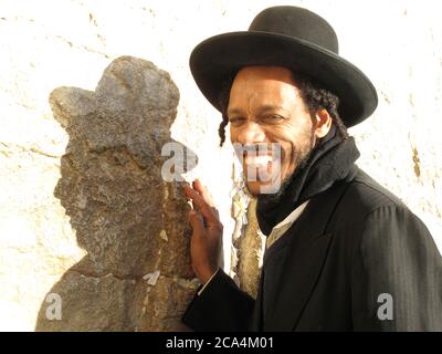 Smiling Hassidic Jewish man looking at camera in the Prayer Hall, Western Wall (Wailing Wall), Old City, Jerusalem, Israel