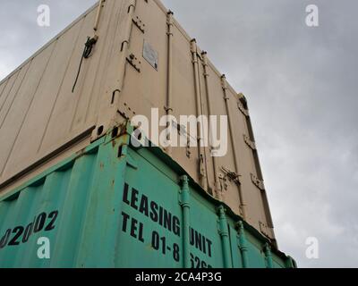 Container cabin place overlap on another container in Cloudy day Stock Photo