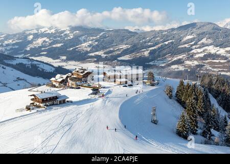 Elevated view of hotel and restaurant buildings on the slopes at Kirchberg in Tirol, part of the Kitzbühel ski area in Austria. Stock Photo