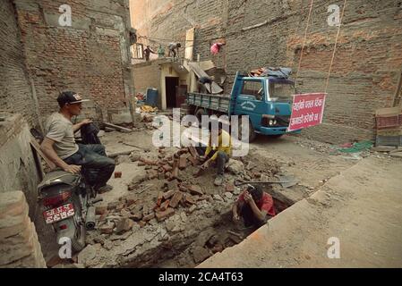 Workers doing construction work in Thamel area, Kathmandu, Nepal, one year after the 2015 earthquakes. Stock Photo