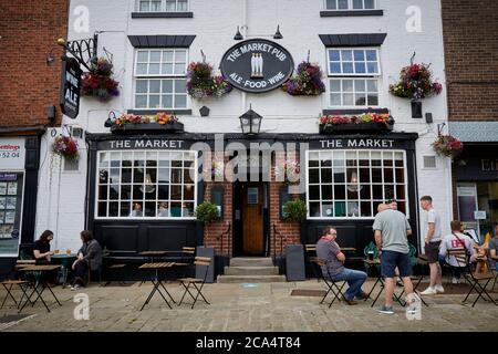 Chesterfield town centre in Derbyshire The Market Pub pavement drinking and pretty hanging basket flowers Stock Photo