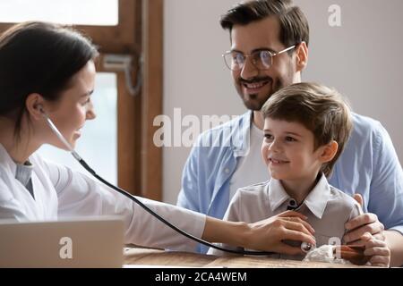 Happy daddy meeting family therapist with small kid son. Stock Photo