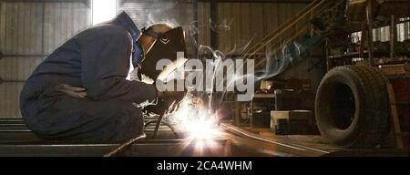 Man welding in a workshop Stock Photo