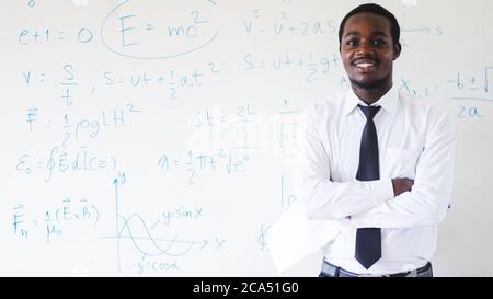 African teacher teaching science in the classroom Stock Photo