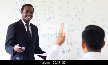 African teacher teaching science in the classroom Stock Photo