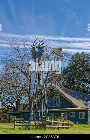 An aerator Windmill outside one of the Visitor Centres at the Brazos bend State Park in Texas on a sunny day in March. Stock Photo
