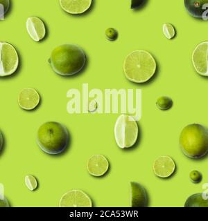fresh slices lime on a light green background, seamless lime pattern Stock Photo