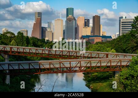 Elevated walkway over Buffalo Bayou with downtown skyline in background, Houston, Texas, USA Stock Photo
